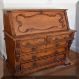 F100. Eastlake Slant top 5 drawer oak desk with leather writing surface. 44”h x 36”w x 18”d - $250 